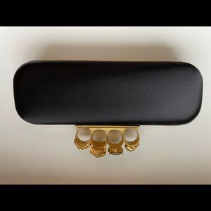 Alexander McQueen 4 skull clutch.